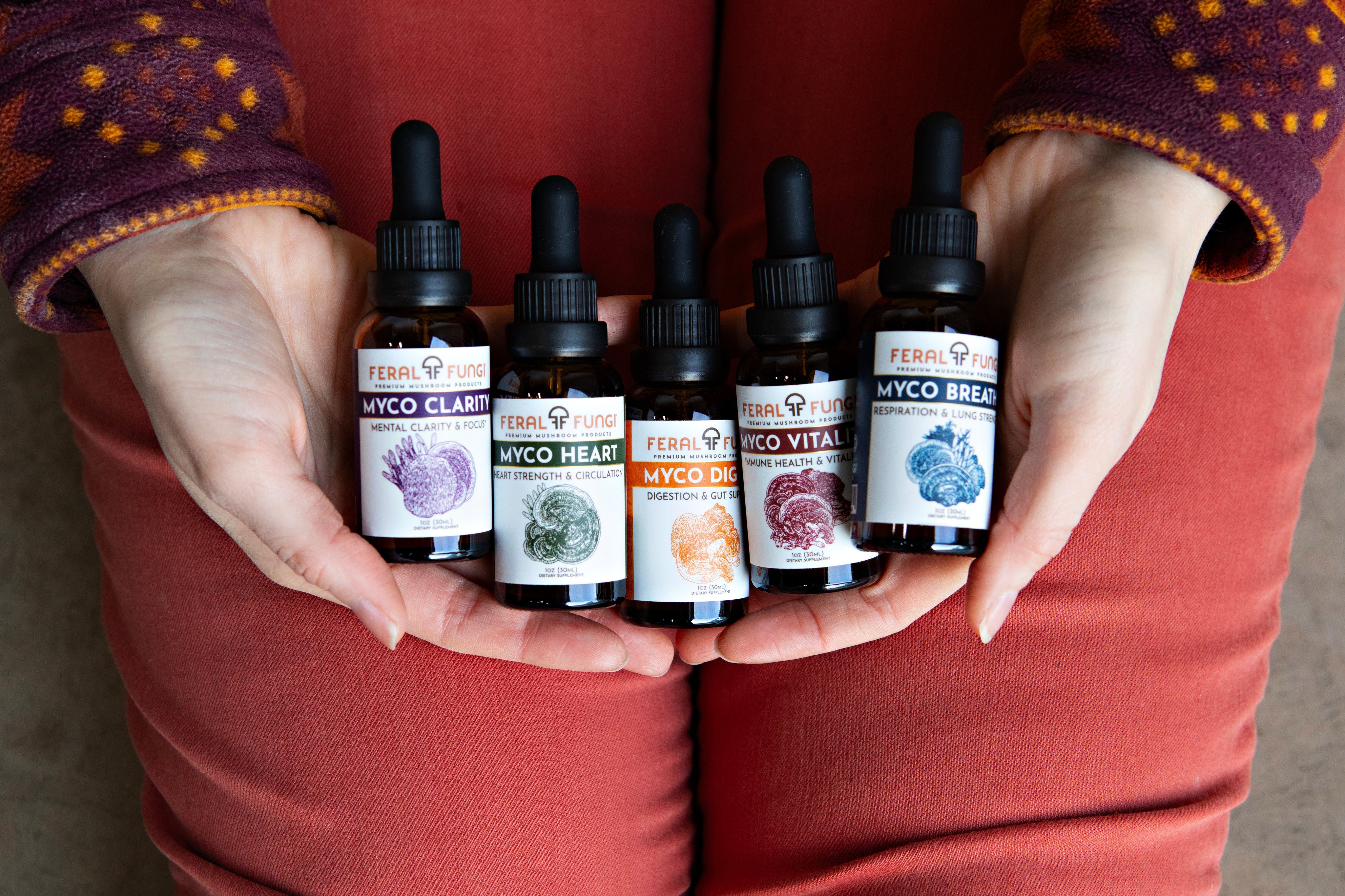 FF-Dec23-Hands-Holding-Five-Tincture-Bottles.jpg